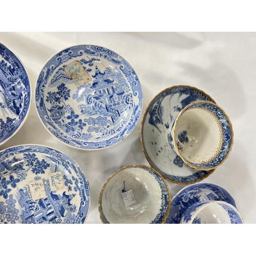 465 - A large collection of English blue and white tea bowls and sauces.