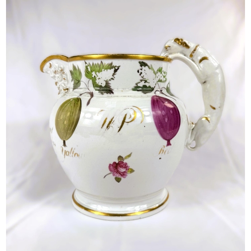 468 - An early 19th century ceramic wine jug with Bacchus spout and dog handle fruit and gilt writing, rub... 