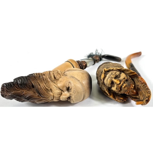 47 - An amber and Meerschaum pipe with silver mount, depicting an arab man's head with beard and turban; ... 