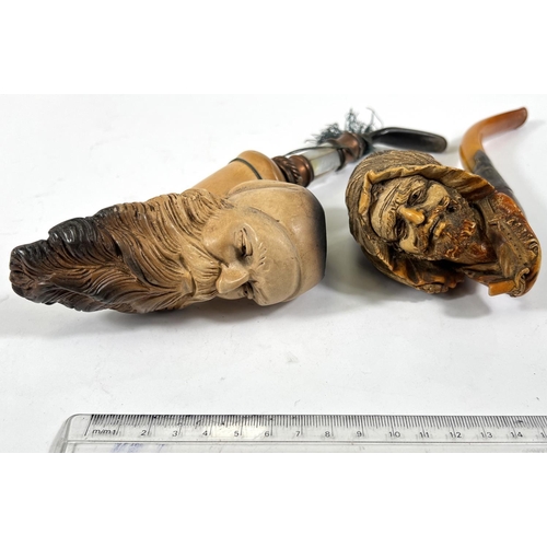 47 - An amber and Meerschaum pipe with silver mount, depicting an arab man's head with beard and turban; ... 