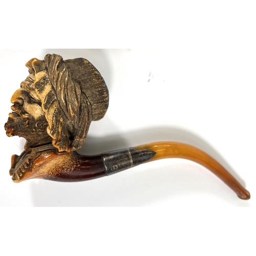 47 - An amber and Meerschaum pipe with silver mount, depicting an arab man's head with beard and turban; ... 