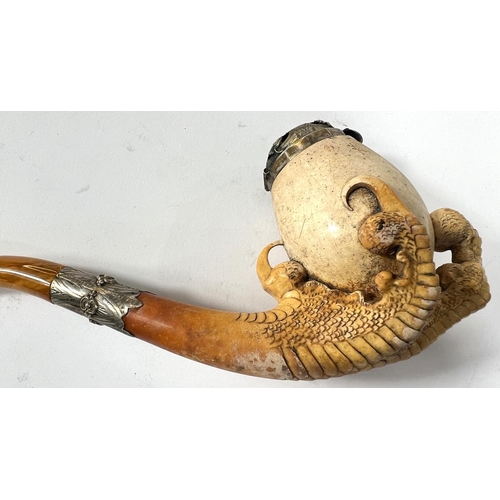 48 - A large cased amber and Meerschaum pipe with egg and claw bowl and white metal mounts, length 22cm.