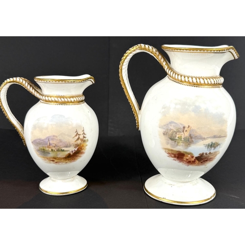 481 - Two - 19th century graduating baluster jugs decorated with polychrome landscapes, heights 16 + 30 cm... 