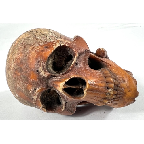 49 - A cased amber and Meerschaum pipe in the form of a skull with chased silver mounts, length 20cm.