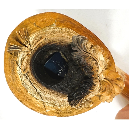 50 - A large cased amber and Meerschaum pipe depicting a bearded man's head with feathered hat (stem slig... 