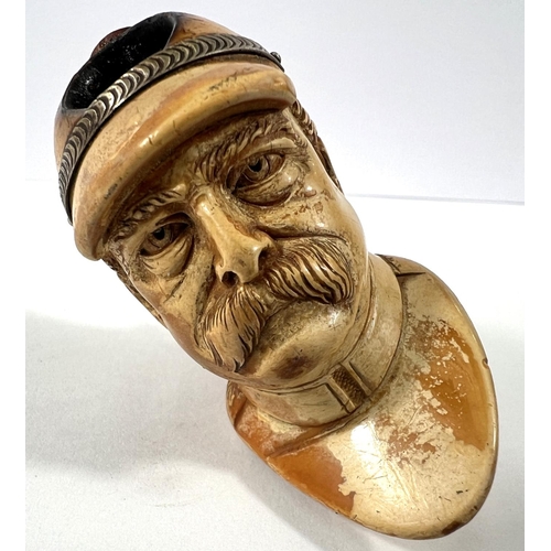 52 - 4 cased amber and Meerschaum pipes depicting Prussian officer's head,  man in the moon, woman's head... 