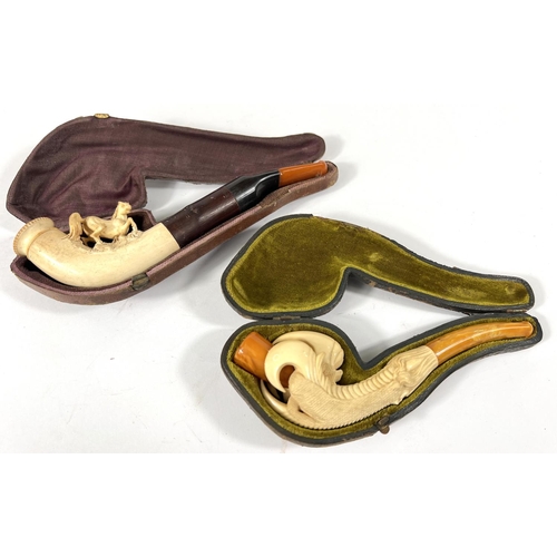 53 - 3 cased amber and Meerschaum pipes depicting a horse, a large claw and a ladies head (broken stem)