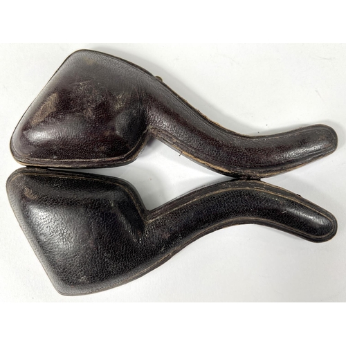 53 - 3 cased amber and Meerschaum pipes depicting a horse, a large claw and a ladies head (broken stem)