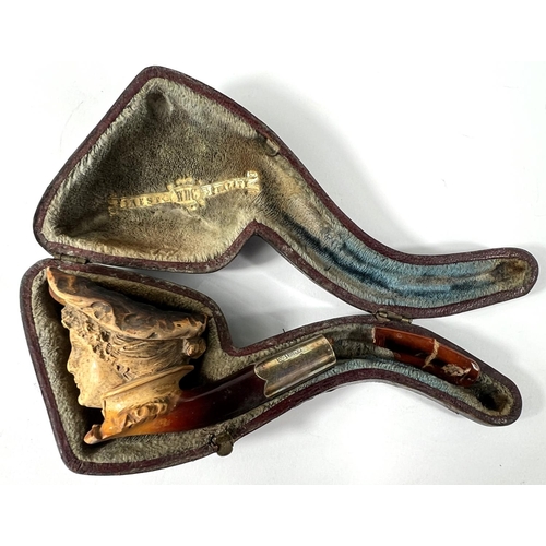 53 - 3 cased amber and Meerschaum pipes depicting a horse, a large claw and a ladies head (broken stem)