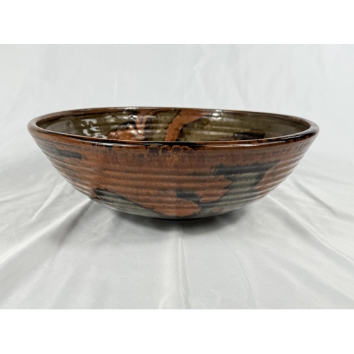 539 - ALAN WARD, studio pottery, a large stoneware bowl, signed in full, 32cm diameter.