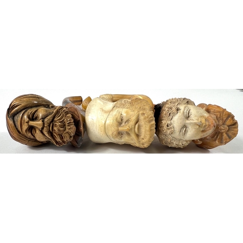 54 - 3 amber and Meerschaum pipes, 2 cased, depicting:- Turk's head with turban; bearded man's head and a... 