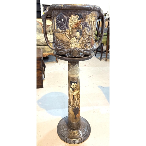 547 - A Bretby style jardiniere decorated with oriental figures, with matching stand (cracked)