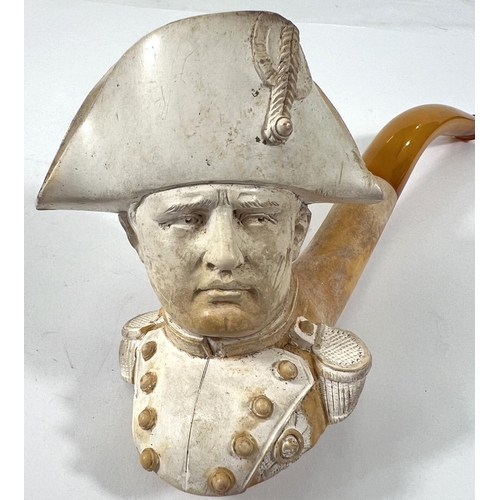 55 - A large cased amber and Meerschaum pipe depicting the head and shoulders of Napoleon.