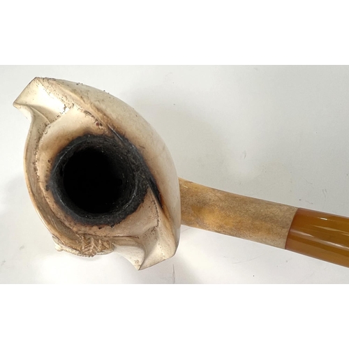 55 - A large cased amber and Meerschaum pipe depicting the head and shoulders of Napoleon.