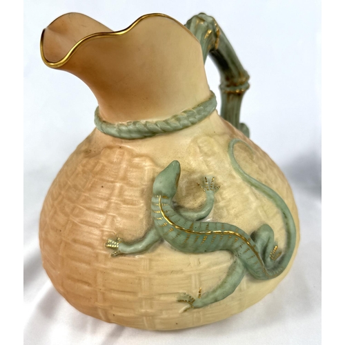 553 - Royal Worcester: a peach ground jug with textured basketry finish and applied lizard Rd No 226402, 1... 