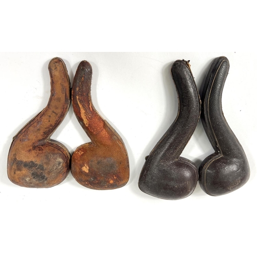 56 - 2 cased amber and Meerschaum pipes depicting skull and crossbones and black man's head.