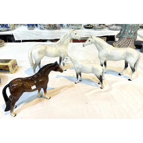 568 - BESWICK, a group of 3 dappled horses, 31cm, 28cm and 20cm; another horse