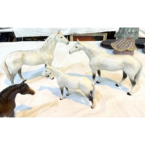 568 - BESWICK, a group of 3 dappled horses, 31cm, 28cm and 20cm; another horse