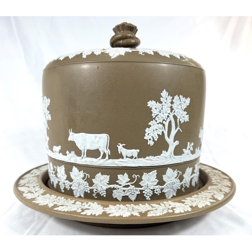 571 - A large 19th century brown Jasperware cheese dish and cover decorated with bucolic scenes, fruiting ... 