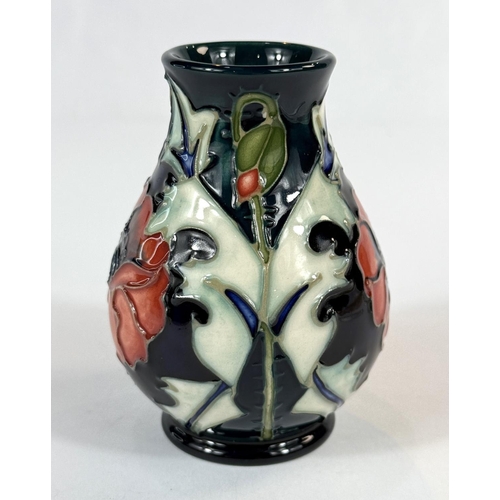 577 - A Moorcroft small baluster blue ground vase, 'Poppy'  designed by Julie Harrison, date stamps to bas... 