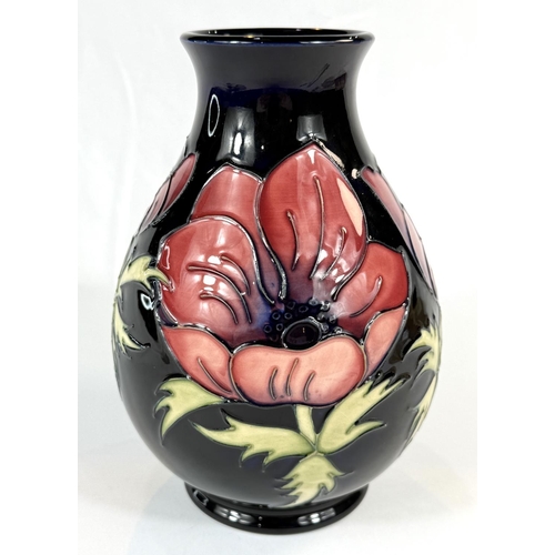 579 - A Moorcroft baluster blue ground Anemone pattern height 19cm marks to base including c. 34/94 (silve... 