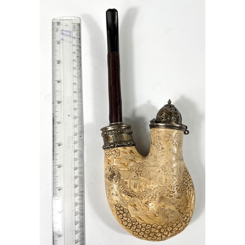 58 - A large Meerschaum pipe with silver lid and collar, cherrywood stem with extensive relief decoration... 