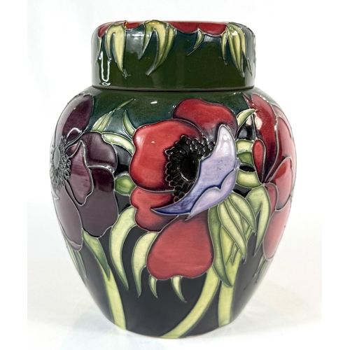 580 - A Moorcroft green ground ginger jar in the Anemone pattern height 14cm (mark to base indicates 'seco... 