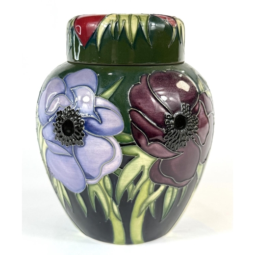 580 - A Moorcroft green ground ginger jar in the Anemone pattern height 14cm (mark to base indicates 'seco... 