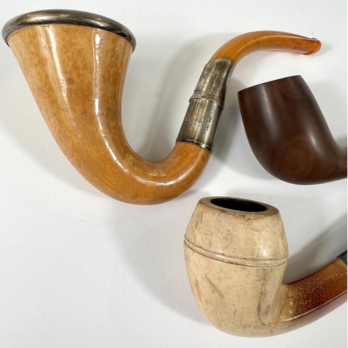 59 - 3 plain cased amber and Meerschaum pipes, each with white metal mounts.