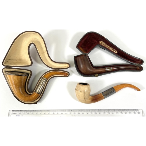 59 - 3 plain cased amber and Meerschaum pipes, each with white metal mounts.