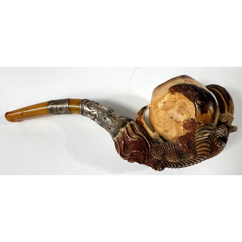 65 - A cased amber and Meerschaum pipe with chased silver mounts & a very realistic claw & egg bo... 