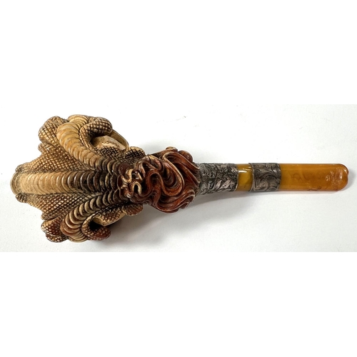 65 - A cased amber and Meerschaum pipe with chased silver mounts & a very realistic claw & egg bo... 