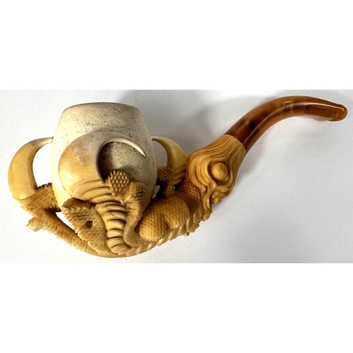 69 - A cased amber and Meerschaum pipe in the form of a claw & egg, length 16cm.