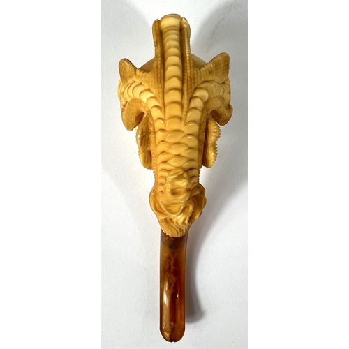 69 - A cased amber and Meerschaum pipe in the form of a claw & egg, length 16cm.