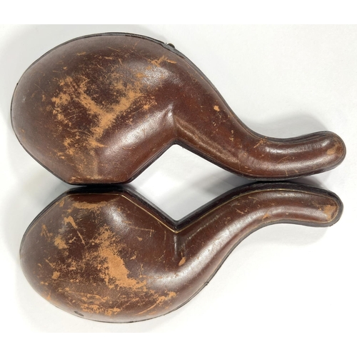 69 - A cased amber and Meerschaum pipe in the form of a claw & egg, length 16cm.