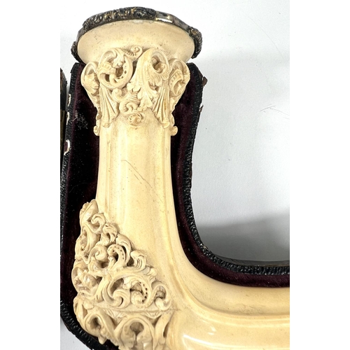 70 - An elongated Meerschaum pipe bowl with relief acanthus and shell decoration (no mouthpiece) length 2... 