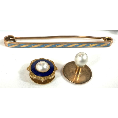 702 - Six gem-set stick pins; a tie clip stamped 