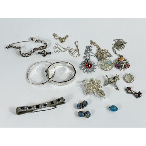 703 - Two silver bangles; an Art Deco gem set multilink bracelet and other Art Deco jewellery.