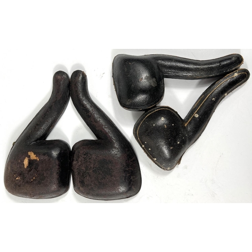 71 - 2 cases amber and Meerschaum pipes, one in the form of a bear with a basket on its back, length 16cm... 