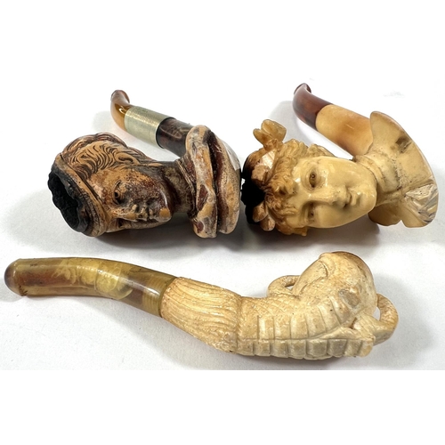 72 - 3 small amber and Meerschaum pipes, including a woman's head, cased; egg & claw, cased; and woma... 