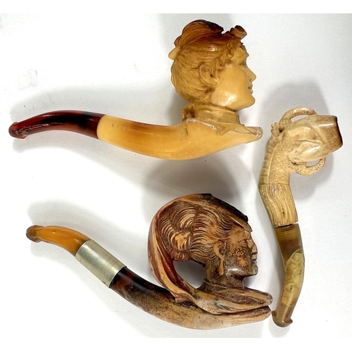 72 - 3 small amber and Meerschaum pipes, including a woman's head, cased; egg & claw, cased; and woma... 