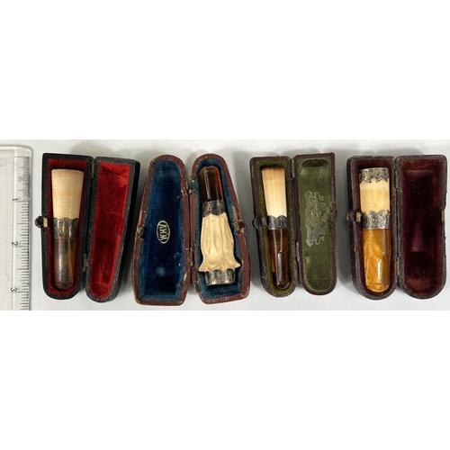 74 - 4 cased amber and Meerschaum cigar holders with silver mounts.