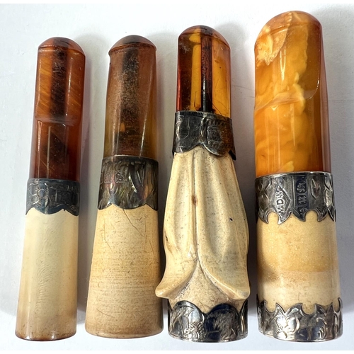 74 - 4 cased amber and Meerschaum cigar holders with silver mounts.