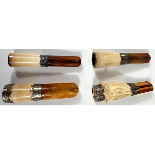 74 - 4 cased amber and Meerschaum cigar holders with silver mounts.