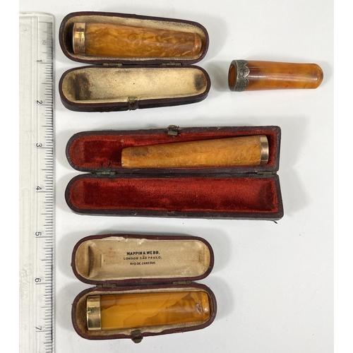 75 - 3 cased, gold mounted amber cigar holders & a similar holder, uncased.