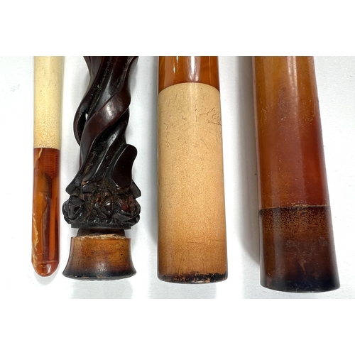 76 - 4 cased decorative amber and Meerschaum cigar/cigarette holders.