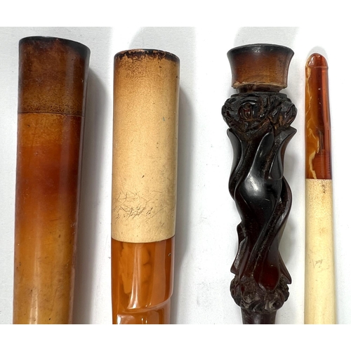 76 - 4 cased decorative amber and Meerschaum cigar/cigarette holders.