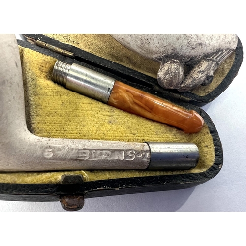 78 - A small cased amber and Meerschaum pipe, and ceramic pipe stand; a white metal cigarette holder case... 