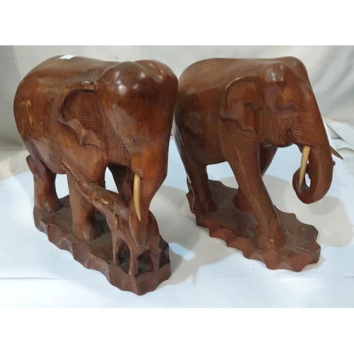 80A - Two wooden elephants.