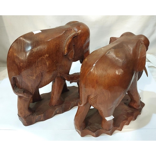 80A - Two wooden elephants.